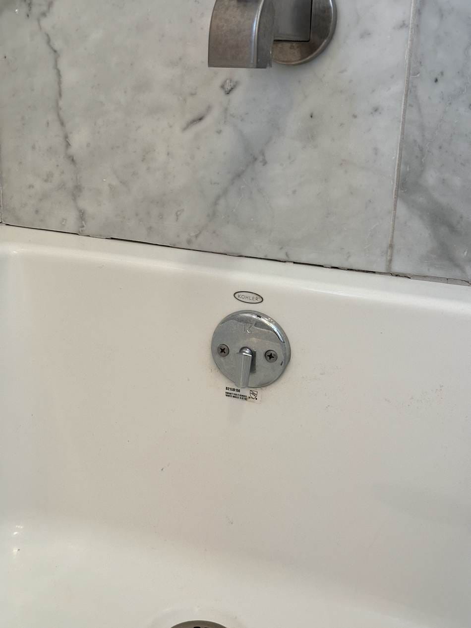 Bathtub with drain and valve before caulking work in West LA, CA 90025