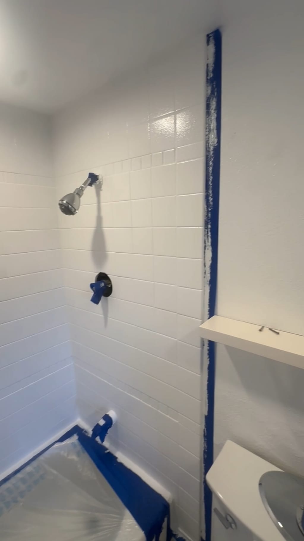 Finished shower with the tile repainted a clean, bright white in Hollywood, CA 90028