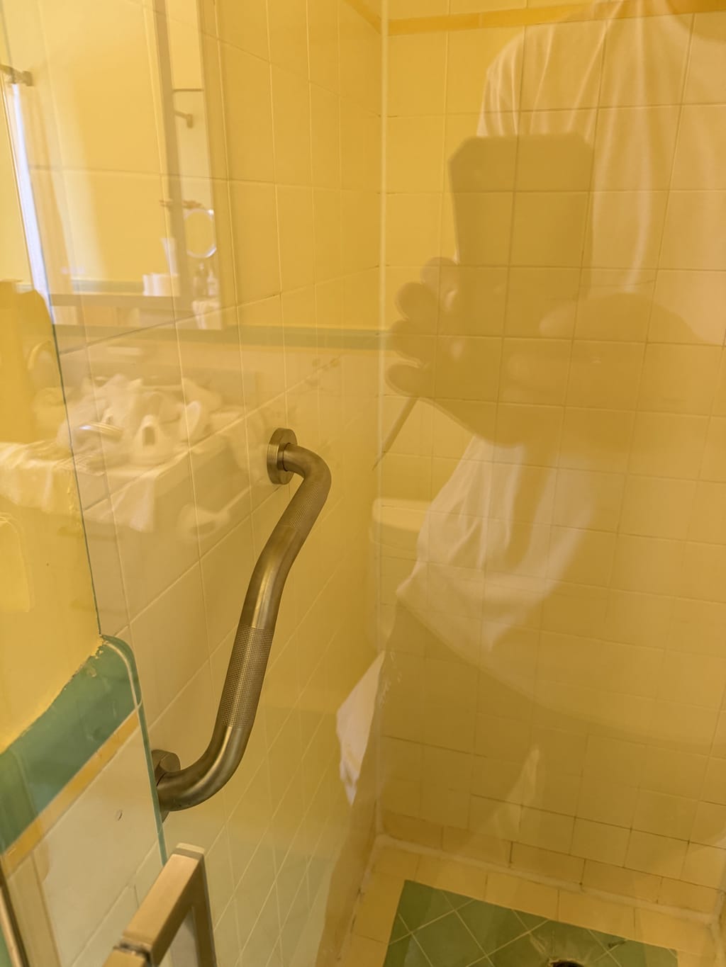 Permanent stud-anchored grab bar installed in a tiled shower in Beverlywood, CA 90035