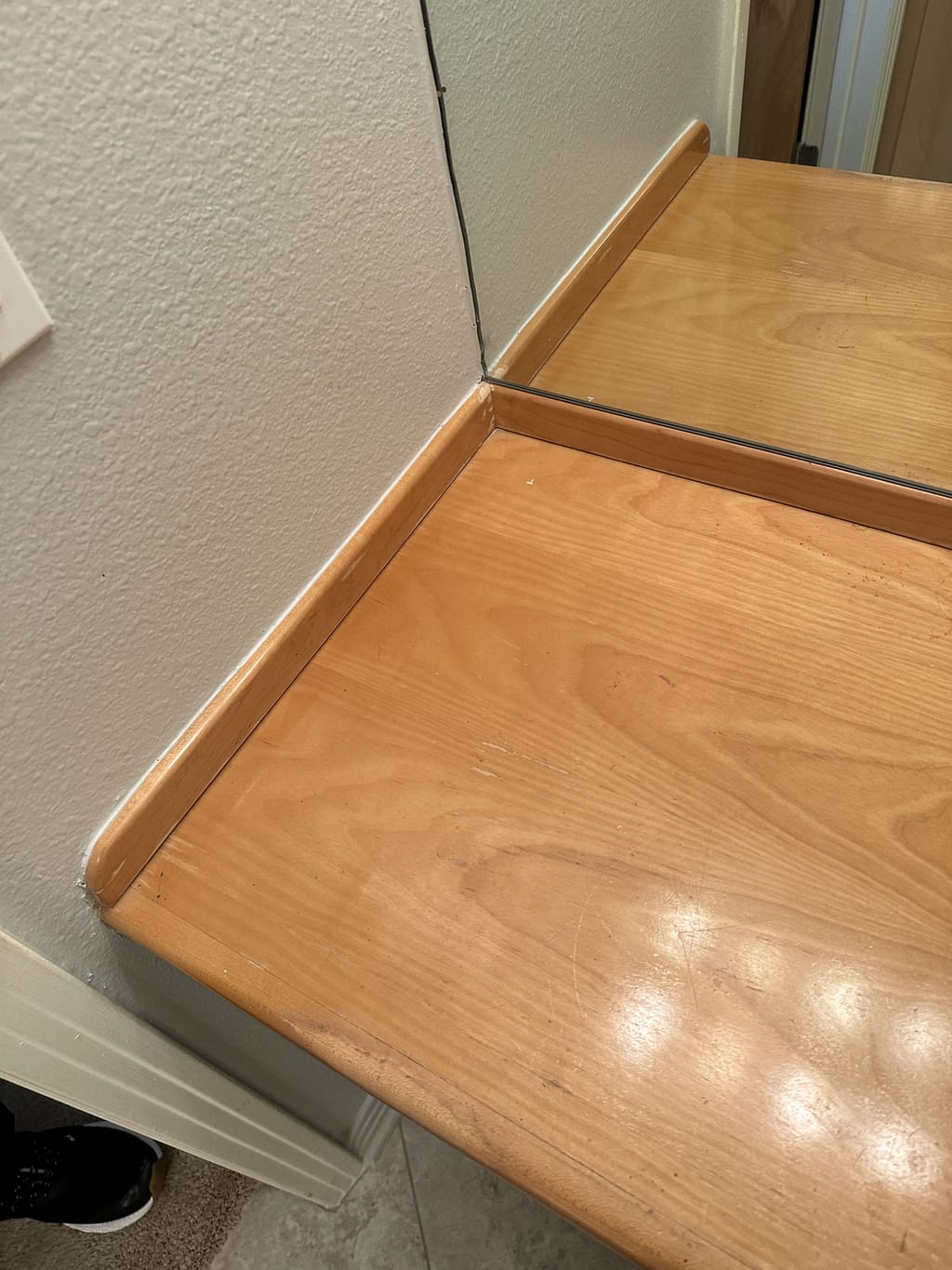 Faded, scratched wood countertop before restaining in Brentwood, CA 90049
