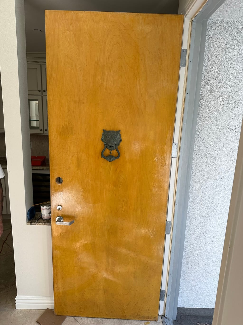 Entrance door restained to a warm, natural wood finish in Brentwood, CA 90049