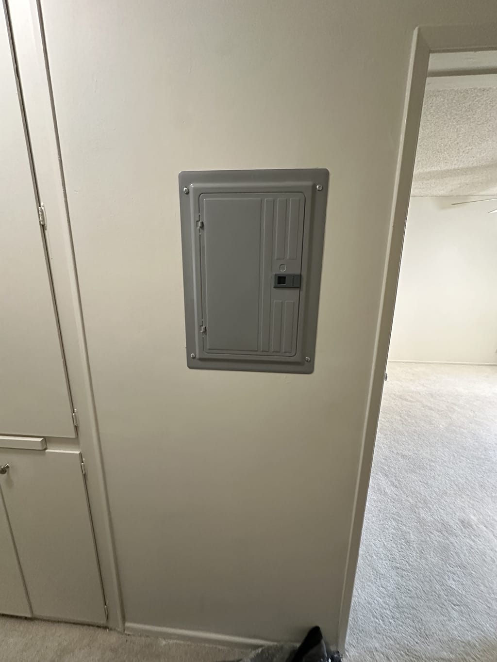Finished, texture-matched and painted wall around a closed electrical panel in Ladera Heights, CA 90056