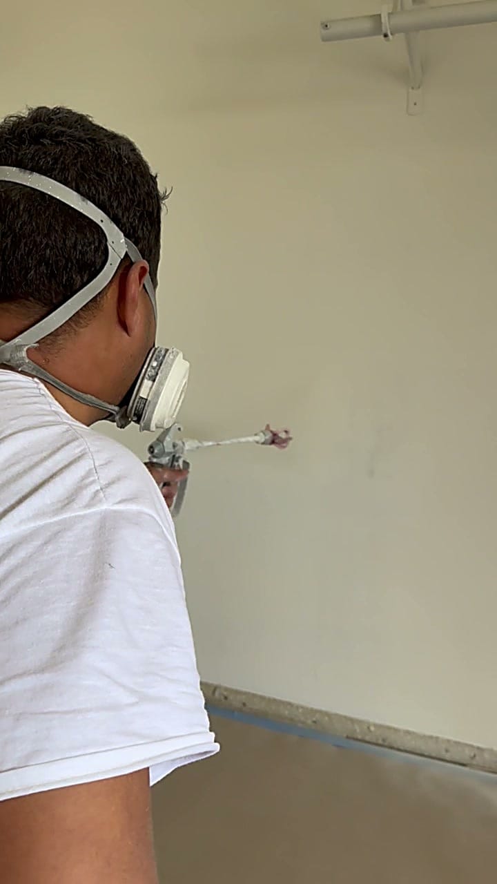 Spray painting an interior wall in Mar Vista, CA 90066
