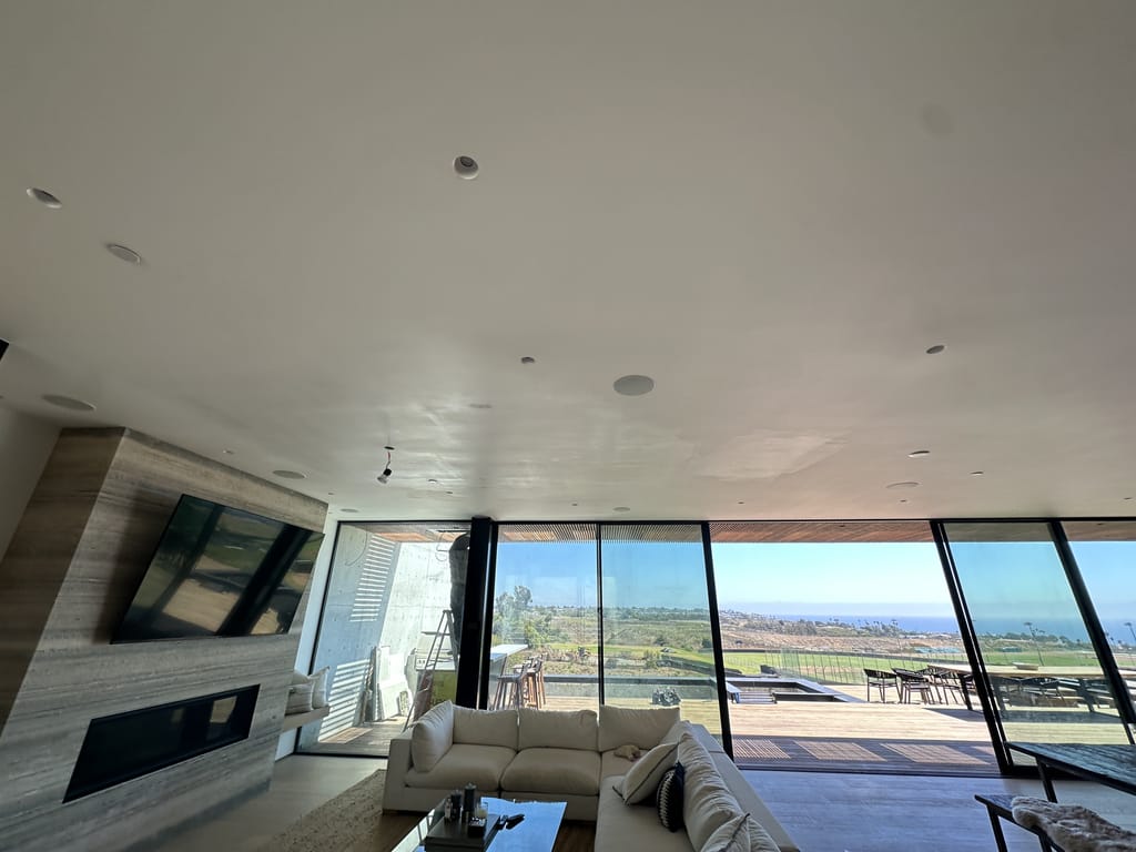 Finished ceiling painting in a bright, view-filled living room in Malibu, CA 90265