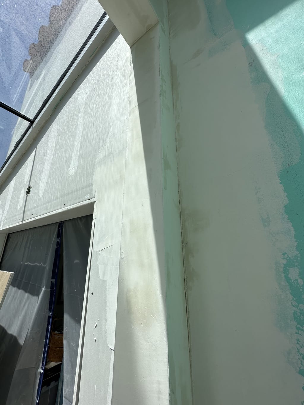 Water-damaged wall rebuilt and finished smooth but unpainted in Glendale, CA 91207