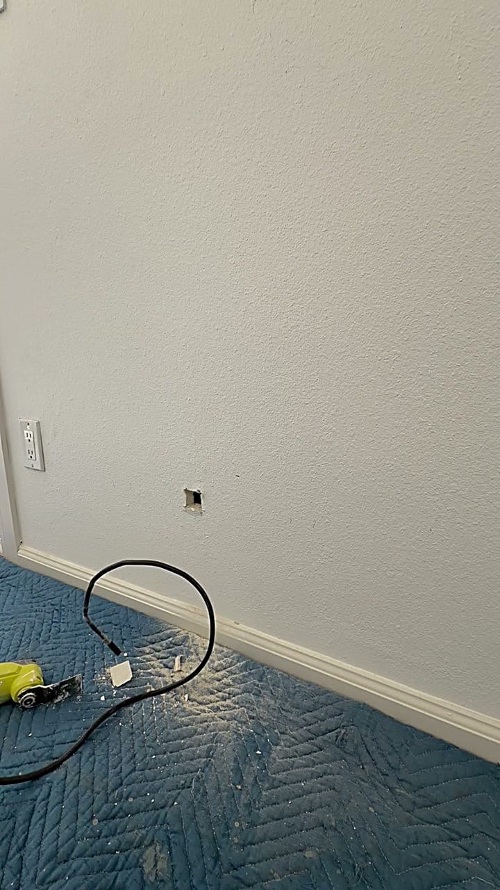 Scanning inside an exterior wall for wiring before cutting a dog door in Canoga Park, CA 91303