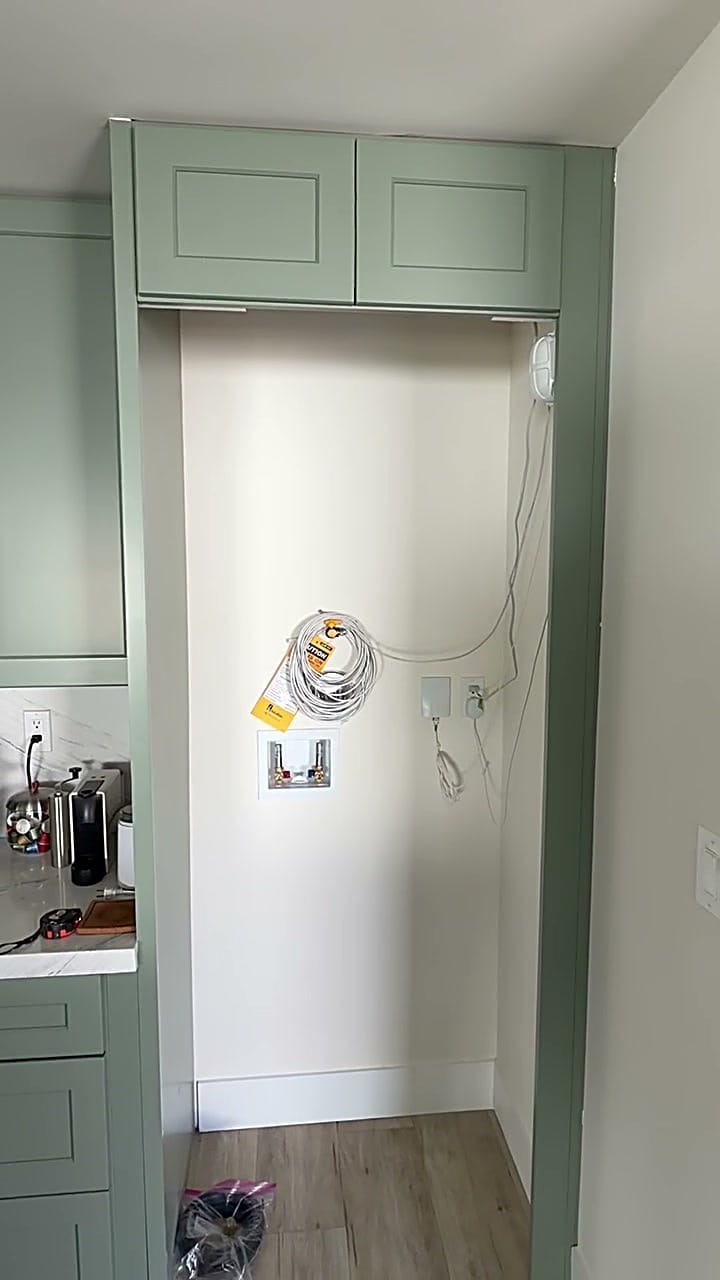 Empty former refrigerator opening in a green cabinet surround before customizing in Burbank, CA 91506