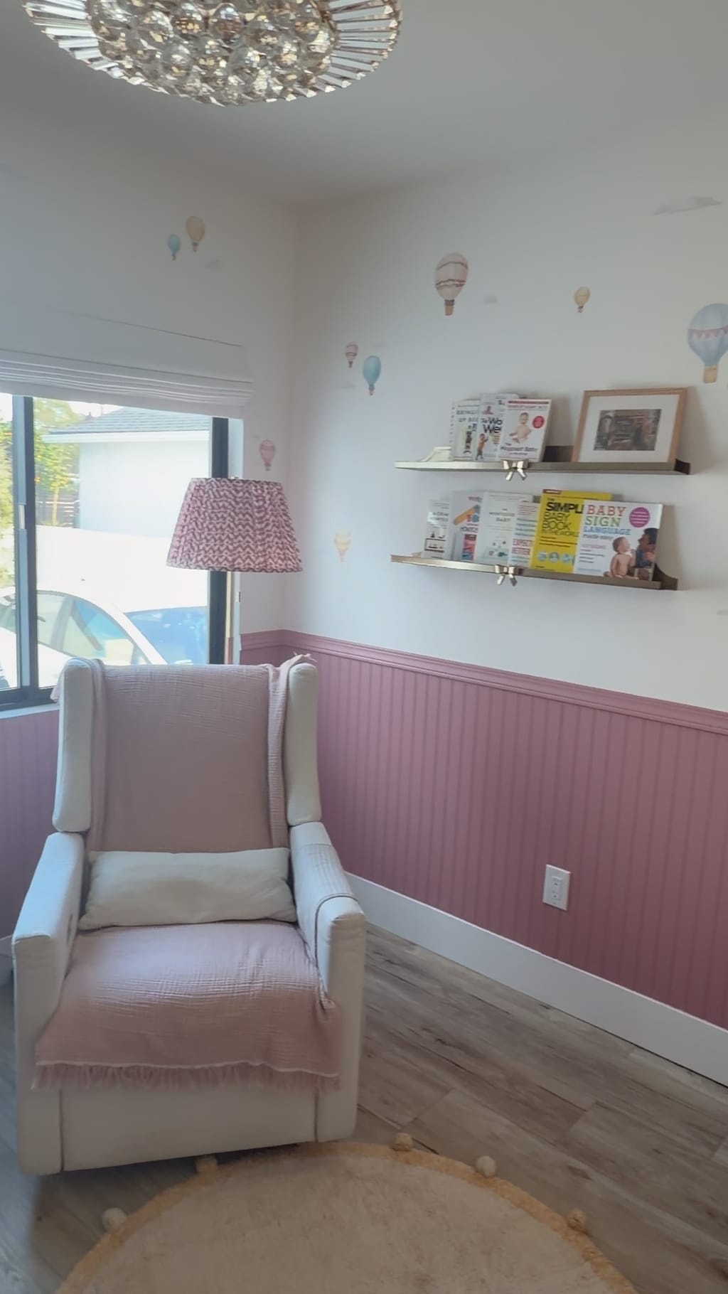 Finished nursery with mauve wainscoting, hot-air-balloon wall decals and a reading nook in Burbank, CA 91506