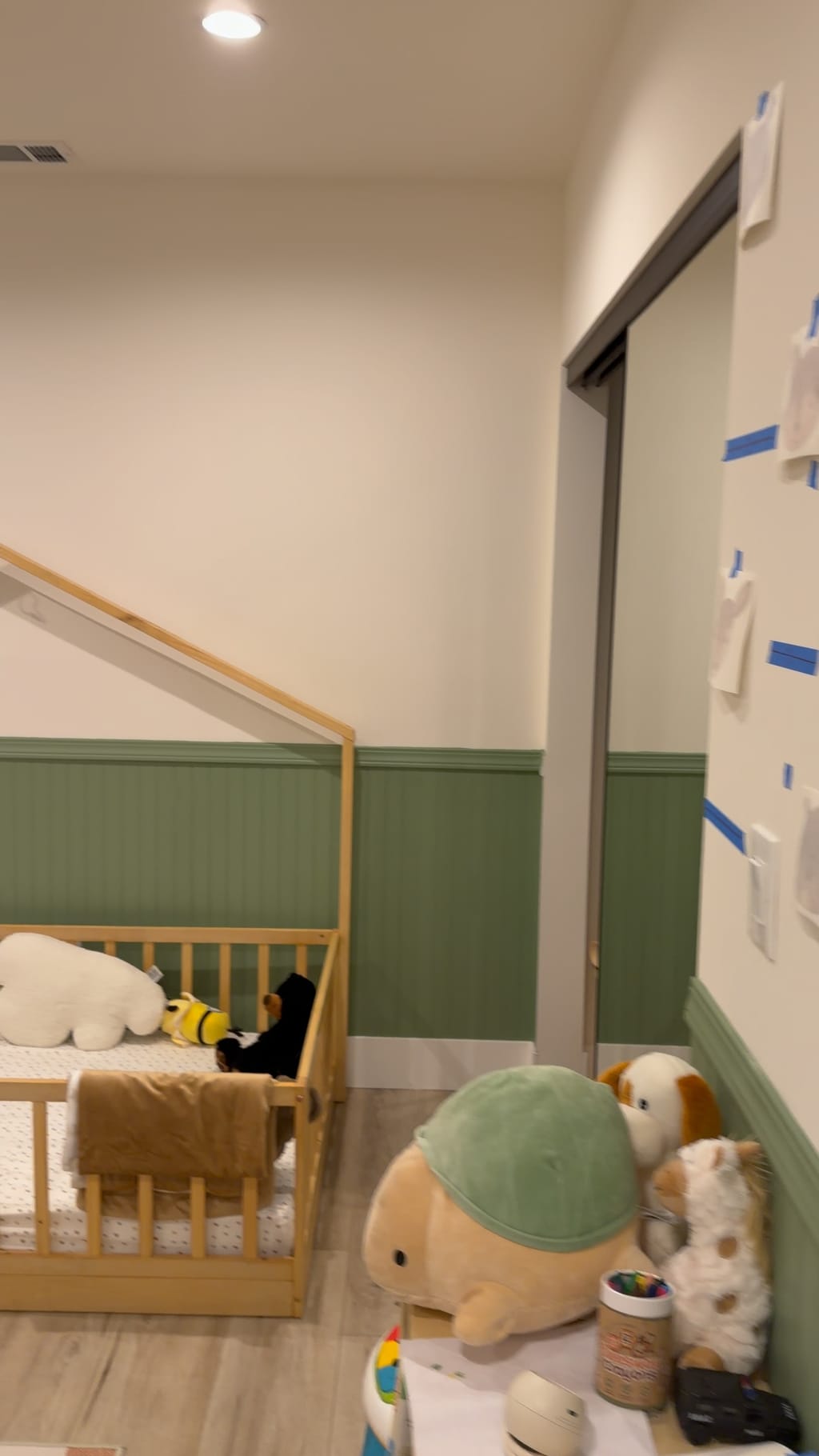 Finished nursery with green wainscoting around the toddler bed and closet in Burbank, CA 91506