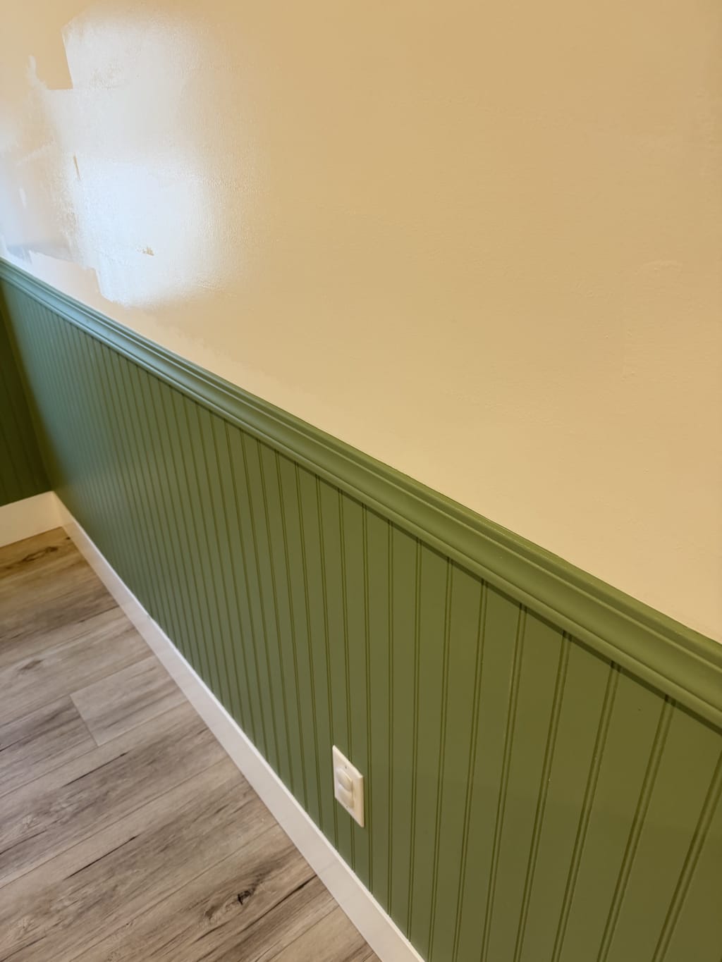Green painted beadboard wainscoting installed with a capped chair rail in Burbank, CA 91506