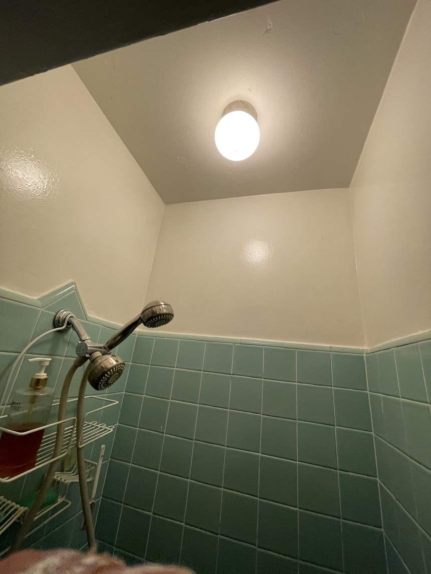 Same shower wall repainted clean white in Studio City, CA 91604