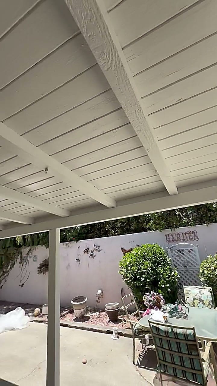 Outdoor wood patio ceiling scraped, primed and repainted clean in Irvine, CA 92618