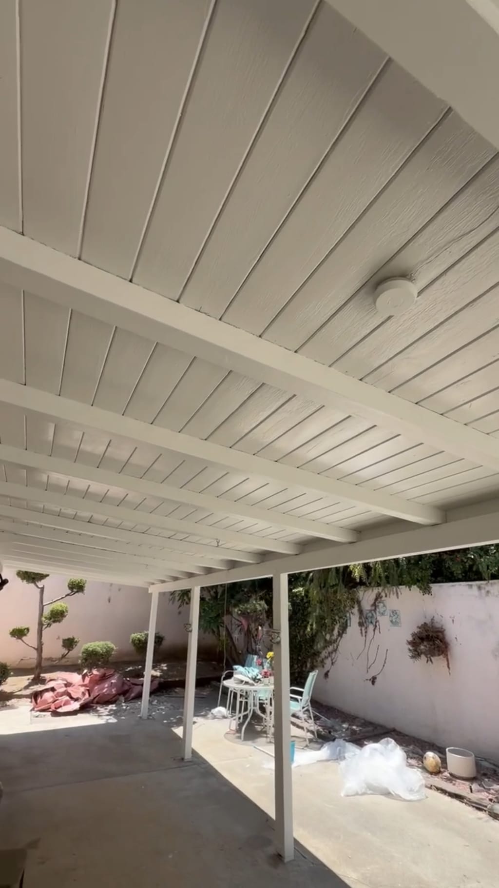 The whole patio with the wood ceiling repainted a clean white in Irvine, CA 92618
