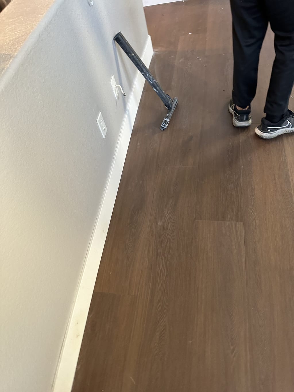 New vinyl plank flooring meeting a freshly painted wall and baseboard in Camarillo, CA 93010