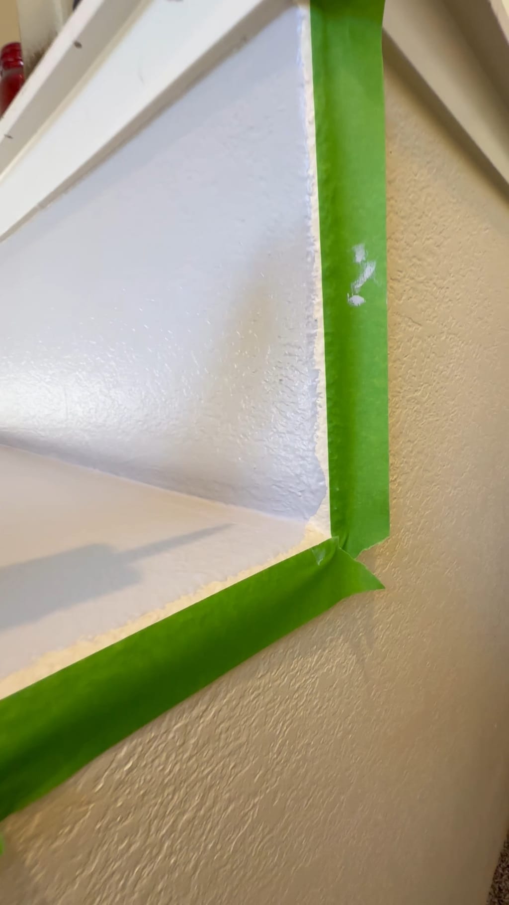Green tape sealing the edge of a two-tone paint line before painting in Camarillo, CA 93010